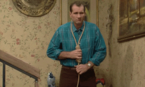 Al Bundy secures the rope around his neck like he does his tie.